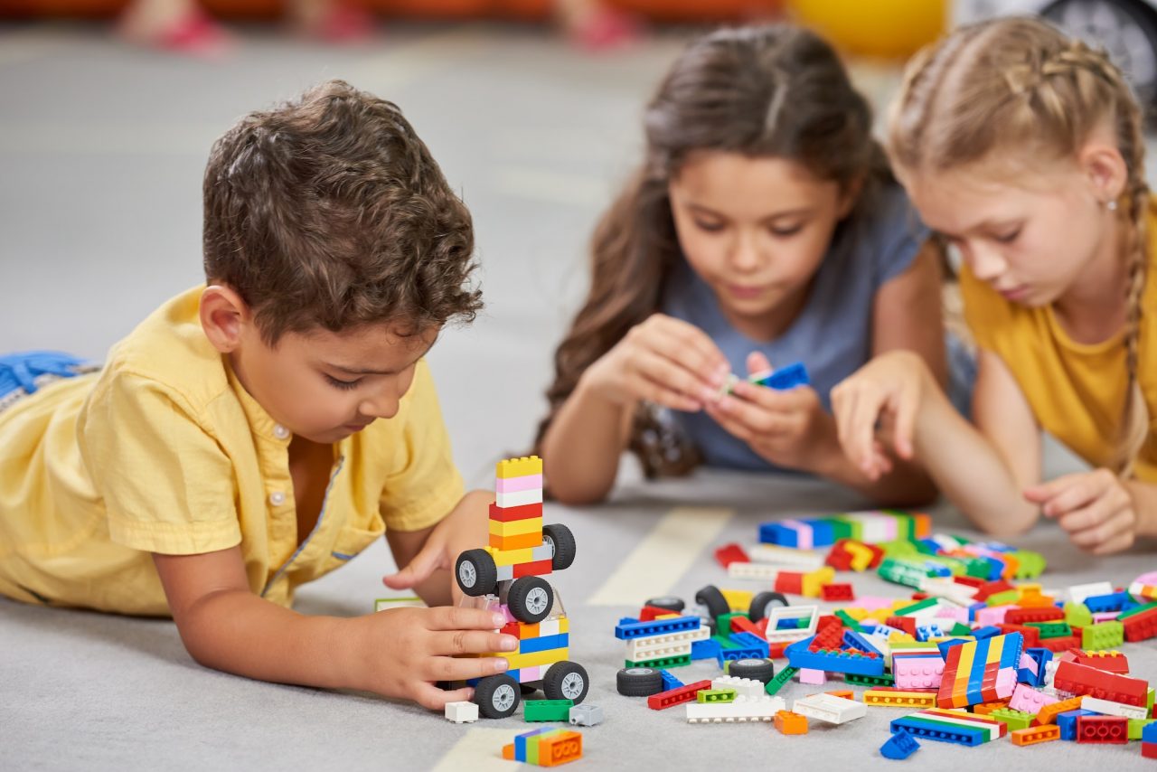 children playing together in the classroom in kindergarten